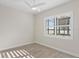 Spacious bedroom with large window and wood floors at 788 Sigsbee Loop, Sarasota, FL 34240