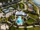 Aerial view of community pool, tennis courts and lake at 788 Sigsbee Loop, Sarasota, FL 34240