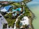 Community pool area with sandy beach and walkways at 788 Sigsbee Loop, Sarasota, FL 34240
