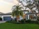 House exterior with lush landscaping at dusk at 788 Sigsbee Loop, Sarasota, FL 34240