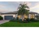 Single-story home with palm tree and landscaping at 788 Sigsbee Loop, Sarasota, FL 34240