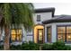 Elegant front entry with glass door and lighting at 788 Sigsbee Loop, Sarasota, FL 34240