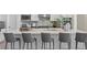Modern kitchen island with white cabinets and quartz countertops at 788 Sigsbee Loop, Sarasota, FL 34240