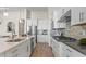 Bright kitchen with stainless steel appliances and white cabinetry at 788 Sigsbee Loop, Sarasota, FL 34240