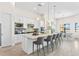 Spacious kitchen with island, stainless steel appliances, and white cabinetry at 788 Sigsbee Loop, Sarasota, FL 34240