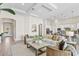 Open living room with neutral decor and access to kitchen at 788 Sigsbee Loop, Sarasota, FL 34240