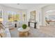 Bright and airy living room with comfortable seating and large windows at 788 Sigsbee Loop, Sarasota, FL 34240