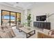 Living room with water view and built-ins at 788 Sigsbee Loop, Sarasota, FL 34240