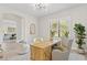 Bright home office features a wooden desk, comfortable chairs, and natural light at 788 Sigsbee Loop, Sarasota, FL 34240