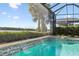 Water features and a spa add to this screened pool area at 788 Sigsbee Loop, Sarasota, FL 34240