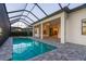 Screened pool and spa with outdoor kitchen access at 788 Sigsbee Loop, Sarasota, FL 34240