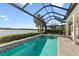 Relaxing pool and spa with screened enclosure overlooking lake at 788 Sigsbee Loop, Sarasota, FL 34240