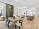 Open-concept dining area with view into living room and kitchen at 8367 Sea Glass Ct, Sarasota, FL 34240