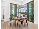 Dining area near sliding glass doors and an outdoor pool at 8367 Sea Glass Ct, Sarasota, FL 34240