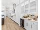 Modern kitchen with stainless steel appliances, wine cooler, and stylish countertops at 8367 Sea Glass Ct, Sarasota, FL 34240