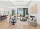 Spacious living room with an open floor plan, sliding glass doors to the patio, and stylish furnishings at 8367 Sea Glass Ct, Sarasota, FL 34240