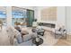 Elegant living room with sliding glass doors to outdoor patio, contemporary decor, and cozy seating at 8367 Sea Glass Ct, Sarasota, FL 34240