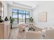 Bright living room with contemporary furnishings, large windows, and calming natural light at 8367 Sea Glass Ct, Sarasota, FL 34240