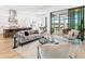 Open-concept living space connecting kitchen and outdoor patio with sleek furnishings and modern design at 8367 Sea Glass Ct, Sarasota, FL 34240