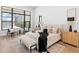 Serene bedroom features a luxurious bed, stylish decor, and lots of natural light at 8367 Sea Glass Ct, Sarasota, FL 34240