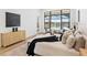 Inviting bedroom with luxurious bed, decor, natural light, and a view of the pool at 8367 Sea Glass Ct, Sarasota, FL 34240