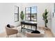 Well-lit office featuring a sleek desk, comfortable seating, and views of the outdoors at 8367 Sea Glass Ct, Sarasota, FL 34240