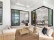 Gorgeous screened-in patio with comfortable seating and views of the pool and interior rooms at 8367 Sea Glass Ct, Sarasota, FL 34240