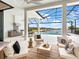 Relaxing screened-in patio with ample seating, an outdoor kitchen, and scenic views of the lake at 8367 Sea Glass Ct, Sarasota, FL 34240