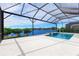 Beautiful pool and spa overlooking the lake, enclosed in a spacious screened lanai at 8367 Sea Glass Ct, Sarasota, FL 34240