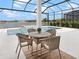 Relaxing pool and spa area with comfortable seating and a view of the lake at 8367 Sea Glass Ct, Sarasota, FL 34240