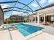 Inviting pool area with a spa and screened enclosure, perfect for outdoor enjoyment at 8367 Sea Glass Ct, Sarasota, FL 34240