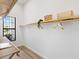 Well-organized walk-in closet with custom wood shelving and ample storage space at 8367 Sea Glass Ct, Sarasota, FL 34240