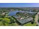 Aerial view of community tennis courts and lake at 8532 Pavia Way, Lakewood Ranch, FL 34202