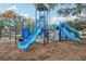 Community playground with slides, climbing structures, and swings for  at 11113 Coventry Grove Cir, Lithia, FL 33547