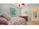 Light and airy bedroom with double doors leading to hallway at 11705 Clubhouse Dr, Lakewood Ranch, FL 34202