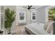 Bright bedroom with wood-look floors, large windows, and neutral tones at 118 24Th W St, Bradenton, FL 34205