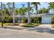 Charming single story home with a brick walkway and lush landscaping at 118 24Th W St, Bradenton, FL 34205