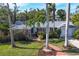 Single-story home with palm trees, brick walkway and driveway at 118 24Th W St, Bradenton, FL 34205