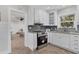 Modern kitchen with stainless steel appliances and white cabinets at 118 24Th W St, Bradenton, FL 34205