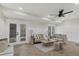Spacious living room with herringbone floors and neutral decor at 118 24Th W St, Bradenton, FL 34205