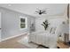 Main bedroom with gray shiplap accent wall and plush bedding at 118 24Th W St, Bradenton, FL 34205