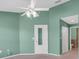 Bright bedroom with ceiling fan, carpet flooring, and closet at 1702 Fairway Trce # 1702, Palmetto, FL 34221