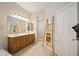 Elegant bathroom with double vanity, large mirror, and a separate shower at 22435 Panther Loop, Bradenton, FL 34202