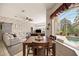 Casual dining area with pool views from large windows at 22435 Panther Loop, Bradenton, FL 34202