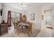 Formal dining room with a glass-top table and six chairs at 22435 Panther Loop, Bradenton, FL 34202