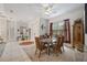 Bright dining room with glass table and seating for six at 22435 Panther Loop, Bradenton, FL 34202