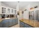 Modern kitchen with granite countertops and stainless steel appliances at 22435 Panther Loop, Bradenton, FL 34202