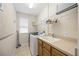 Laundry room with washer, dryer, and utility sink at 22435 Panther Loop, Bradenton, FL 34202