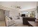 Spacious living room with sectional sofa and large windows at 22435 Panther Loop, Bradenton, FL 34202