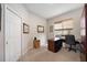 Bright home office with built-in wooden desk and cabinets at 22435 Panther Loop, Bradenton, FL 34202